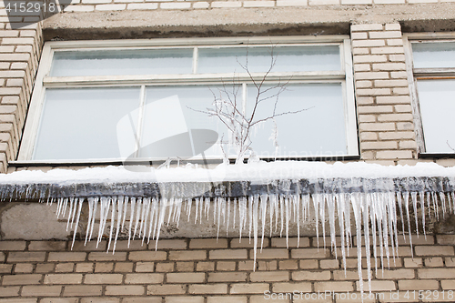 Image of icicles on building or living house facade