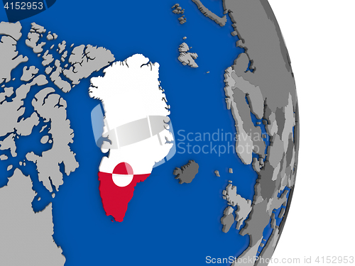 Image of Greenland on globe with flag