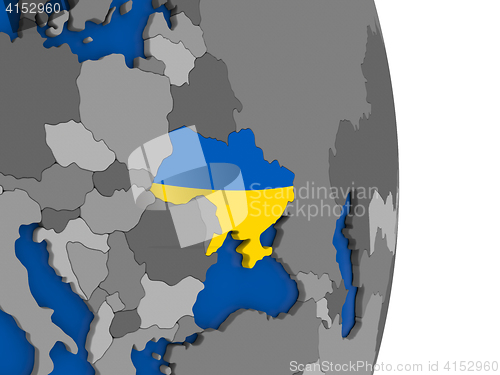 Image of Ukraine on globe with flag