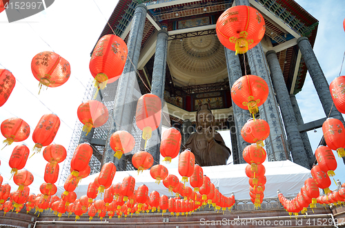 Image of Guanyin and a red lanterns in Chinese Temple Penang, Malaysia