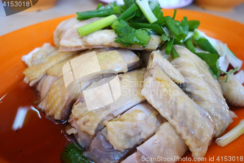 Image of Boiled whole chicken cut into sliced portions