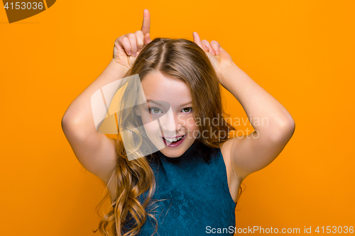 Image of The face of playful happy teen girl