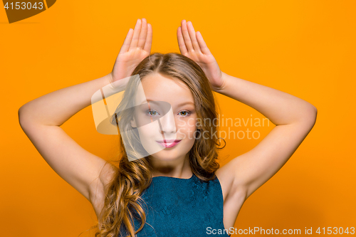 Image of The face of playful happy teen girl