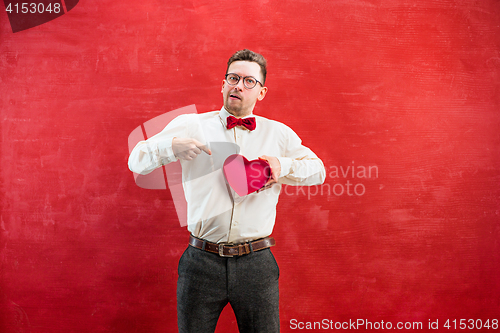 Image of Young funny man with abstract heart