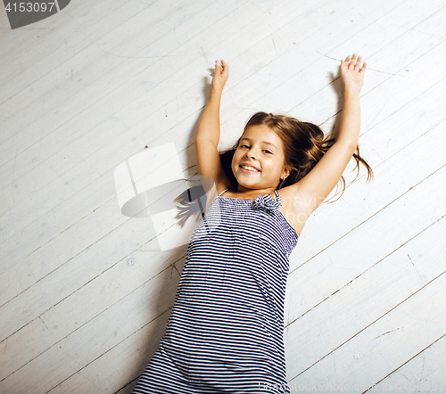 Image of little cute brunette girl at home interior happy smiling close up