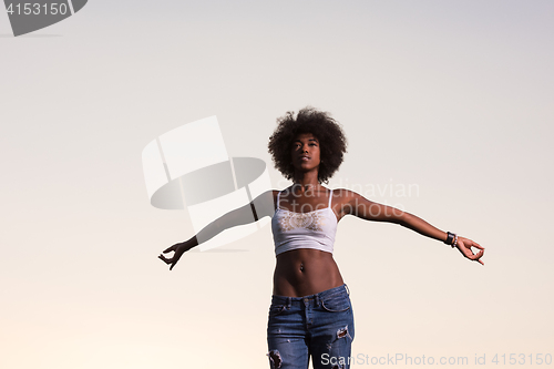 Image of young black woman in nature