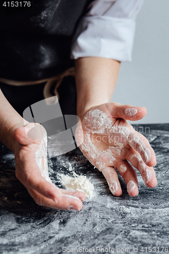 Image of Cook picking odd flour