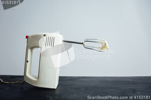 Image of Mixing machine stained with cream
