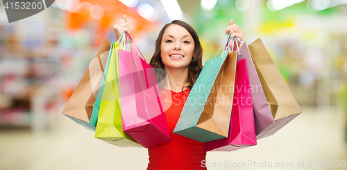 Image of woman with shopping bags at store