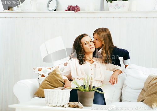 Image of happy smiling mother with little cute daughter at home interior, lifestyle people concept