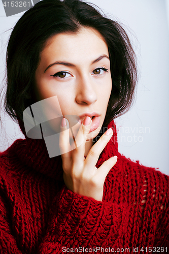 Image of young pretty woman in sweater and scarf all over her face, lifes