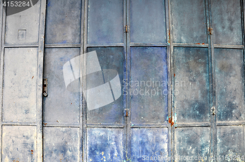 Image of Vintage and old blue metal door