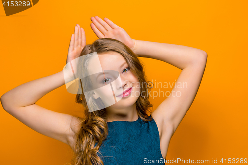 Image of The face of playful happy teen girl