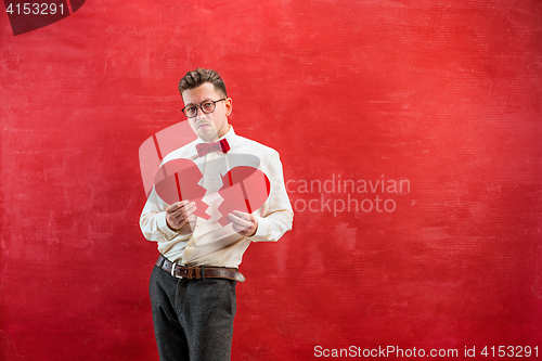 Image of Young funny man with abstract broken heart