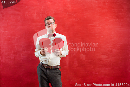 Image of Young funny man with abstract broken heart