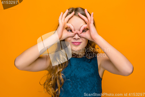 Image of The face of playful happy teen girl