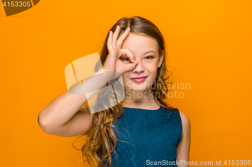 Image of The face of playful happy teen girl