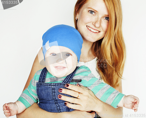 Image of young beauty mother with cute baby, red head happy modern family