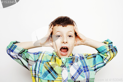 Image of young pretty little boy kid wondering, posing emotional face isolated on white background, gesture happy smiling close up, lifestyle people concept