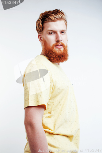 Image of young handsome hipster ginger bearded guy looking brutal isolated on white background, lifestyle people concept