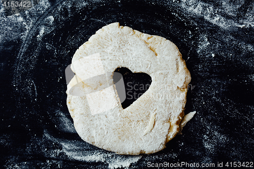 Image of dough with heart cut out