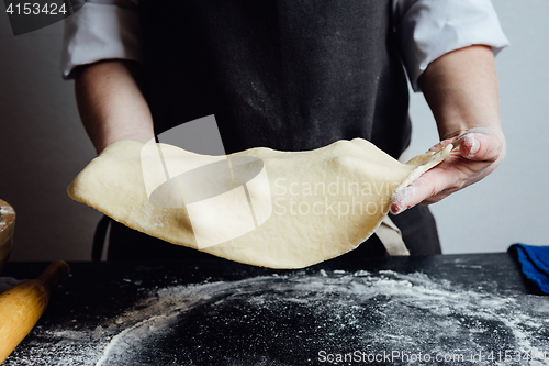 Image of Cook working with homemade sandy paste