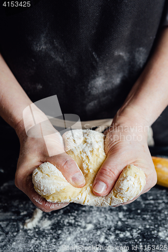 Image of Cook beating up cookie dough