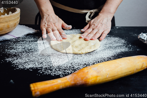 Image of Chef rolling cookie dough