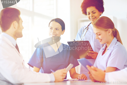 Image of group of happy doctors meeting at hospital office