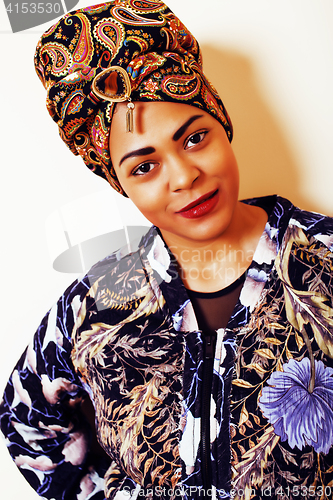 Image of beauty bright african woman with creative make up, shawl on head