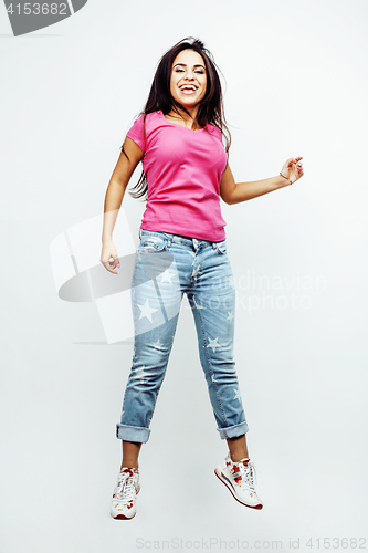 Image of young happy smiling latin american teenage girl emotional posing on white background, jumping flying in joy, lifestyle people concept