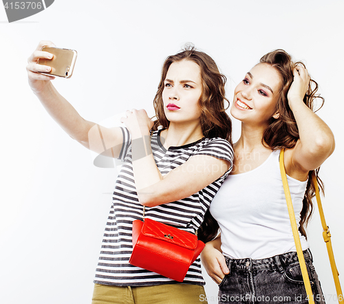 Image of two best friends teenage girls together having fun, posing emotional on white background, besties happy smiling, lifestyle people concept