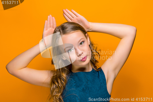 Image of The face of playful happy teen girl