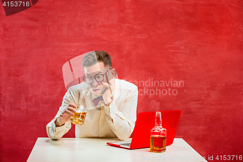 Image of Young funny man with laptop at St. Valentine\'s Day