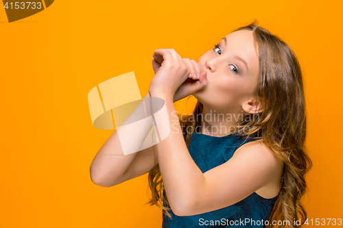 Image of The face of playful happy teen girl