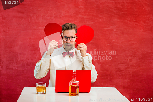 Image of Young funny man with abstract broken heart