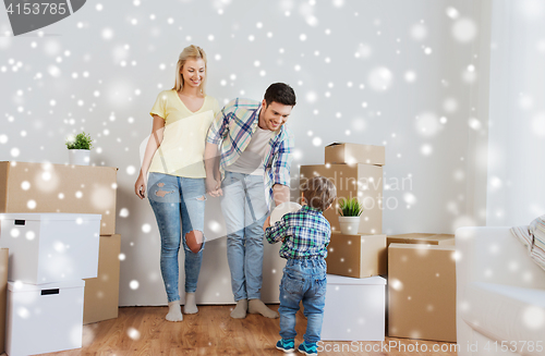 Image of happy family moving to new home and playing ball