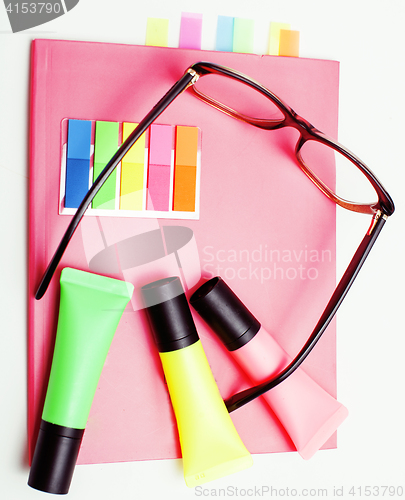 Image of business, education and technology concept - close up of notebook, paper stickers, pencil different stuff on white background