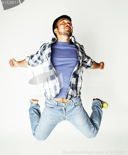 Image of young pretty asian man jumping cheerful against white background, lifestyle people concept