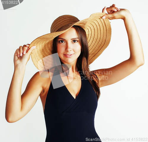 Image of young pretty brunette woman wearing summer hat and swimsuit isolated on white background