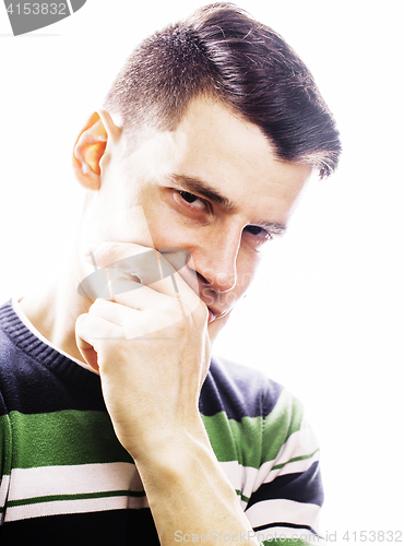 Image of Portrait of a smart serious young man standing against white background. Emotional concept for gesture