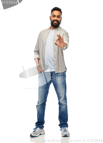 Image of happy smiling indian man showing ok hand sign