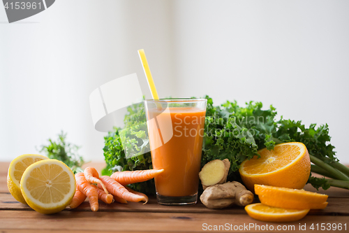 Image of glass of carrot juice, fruits and vegetables