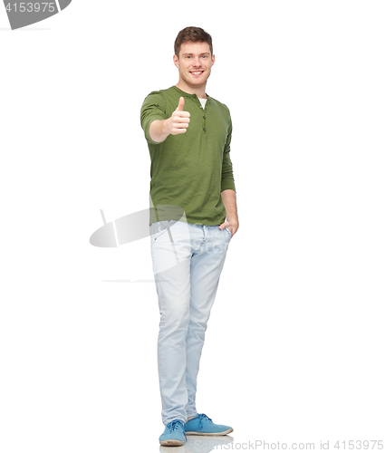 Image of young smiling man showing thumbs up over white