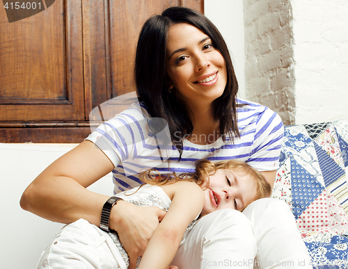 Image of Portrait of mother and daughter playing in bed, lifestyle people concept