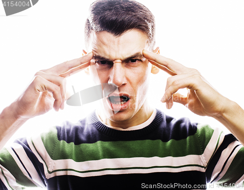 Image of Portrait of a smart serious young man standing against white background. Emotional concept for gesture