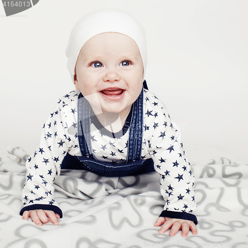 Image of little cute baby toddler on carpet isolated close up smiling, lifestyle people concept