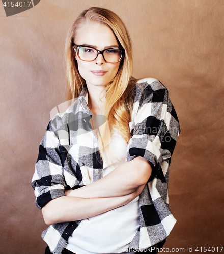 Image of young happy smiling hipster blond girl with backpack ready to sc