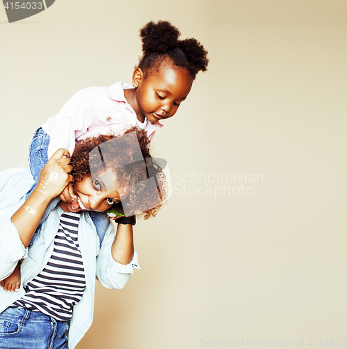 Image of adorable sweet young afro-american mother with cute little daugh