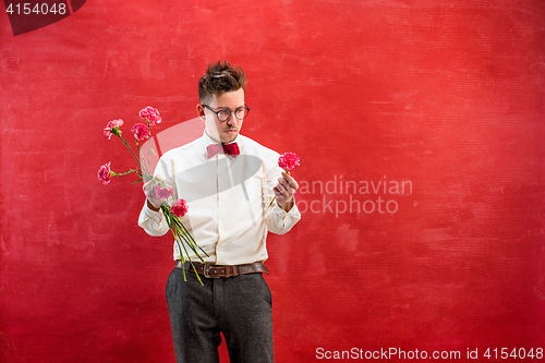 Image of Young funny man with broken bouquet